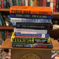 A stack of books by Richard A. Clarke